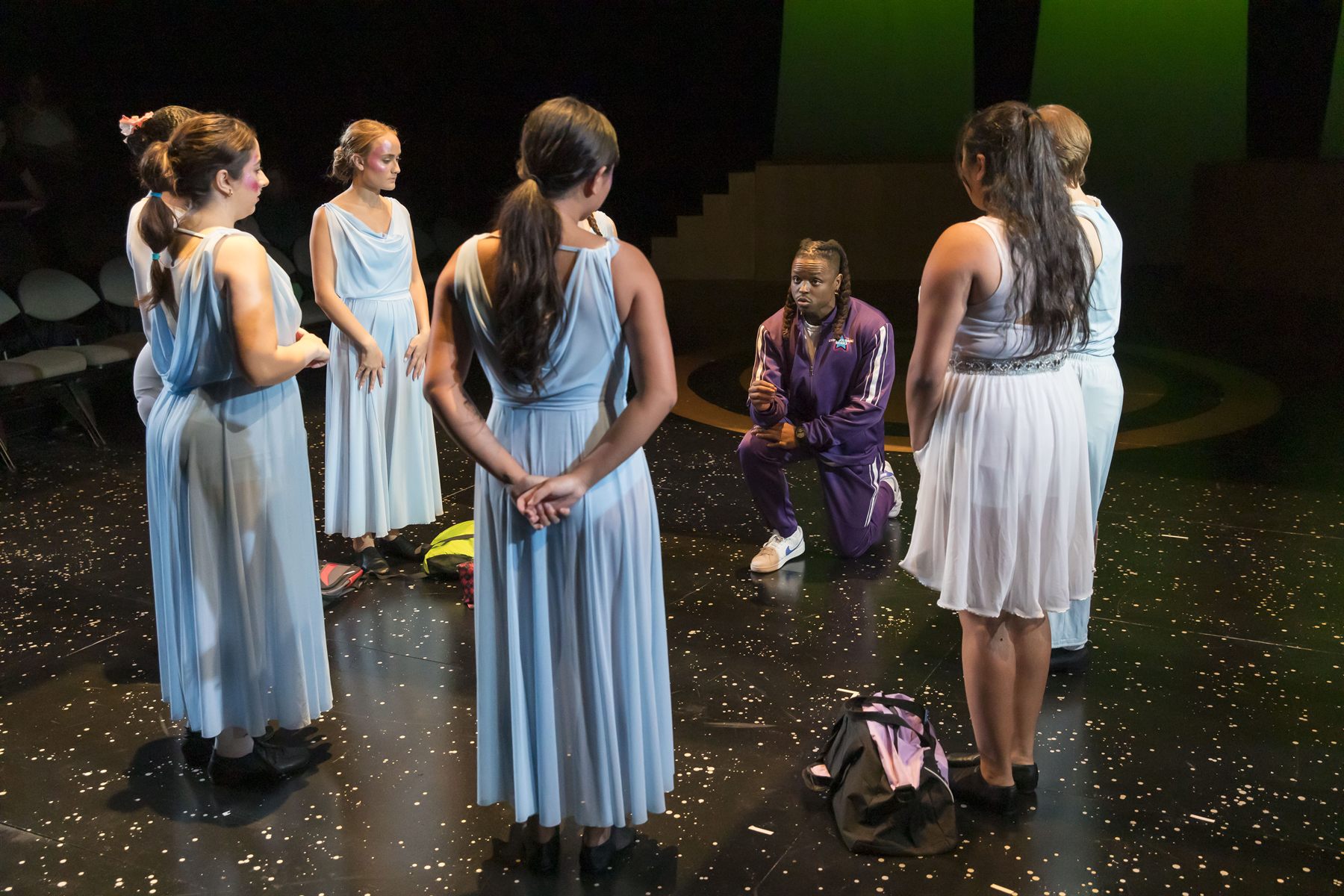 Brian Alexander Davis as Dance Teacher Pat kneeling among dancers, Dance Nation