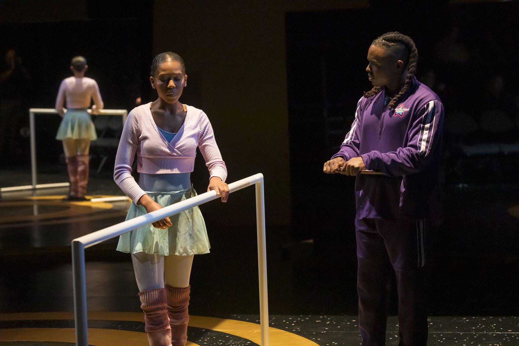 Dance Teacher Pat coaching a dancer at the barre