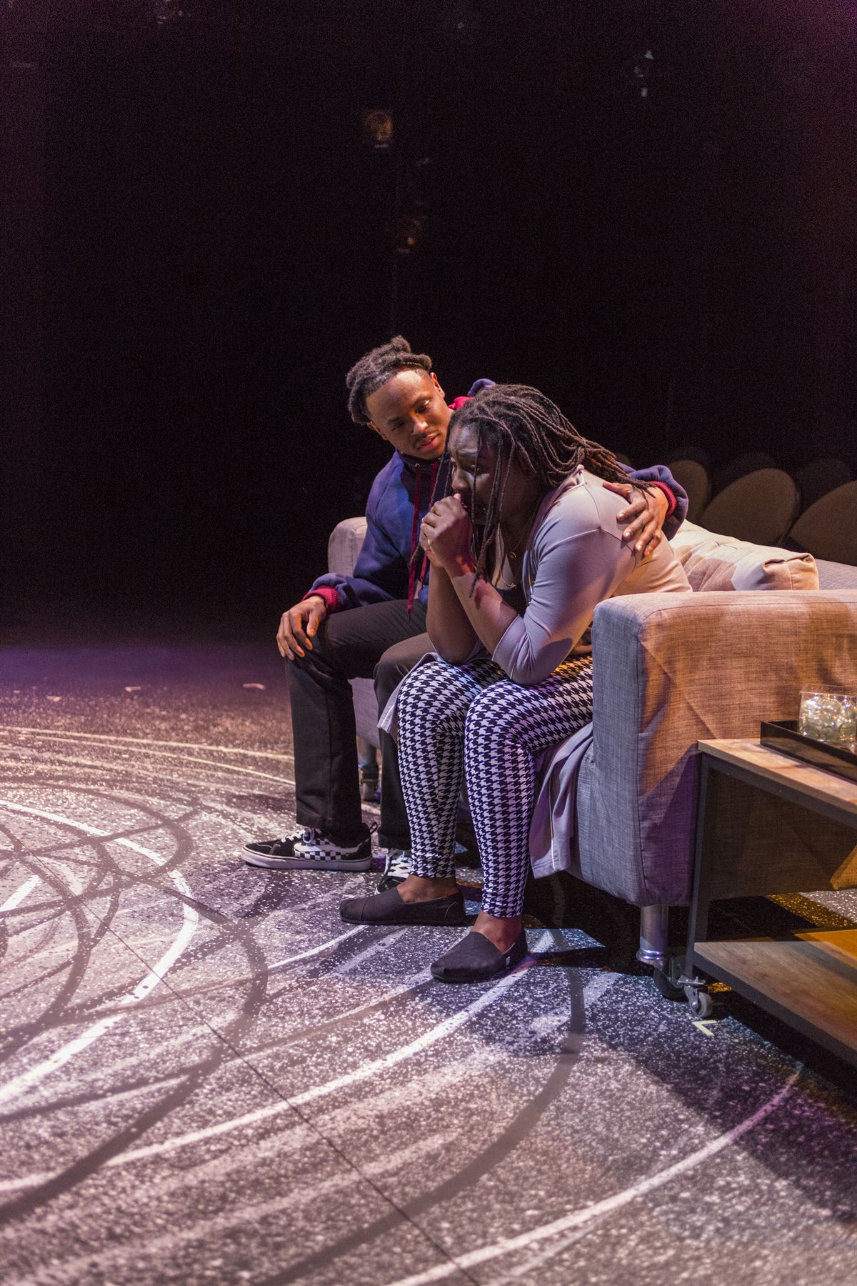 Brian Alexander Davis as Omari comforting a classmate on a couch, Pipeline