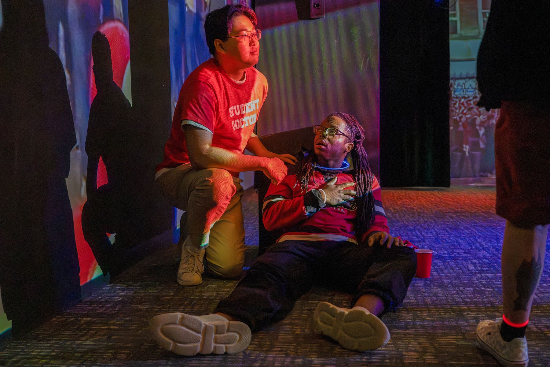 Student doctors assess Brian Alexander Davis, playing an unconscious patient, during a simulated mass-casualty event involving IU medical and theatre students